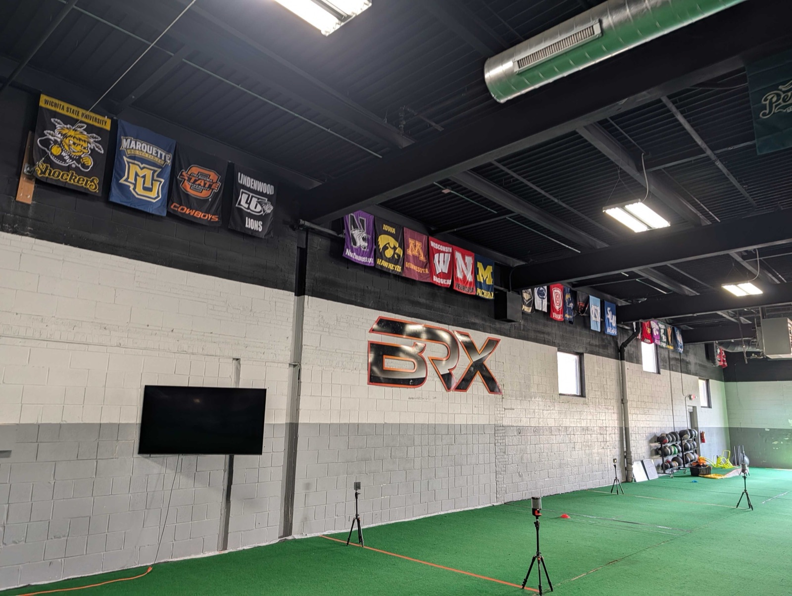 College commitment banners at BRX Performance facility