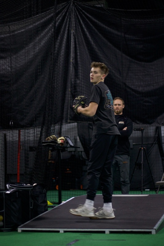 Athlete pitching with BRX coach